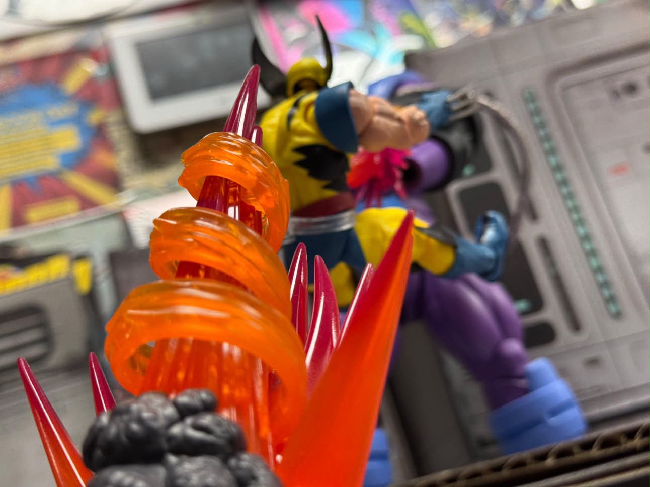 A clawed brawler figure mid-battle with an explosion effect in the foreground
