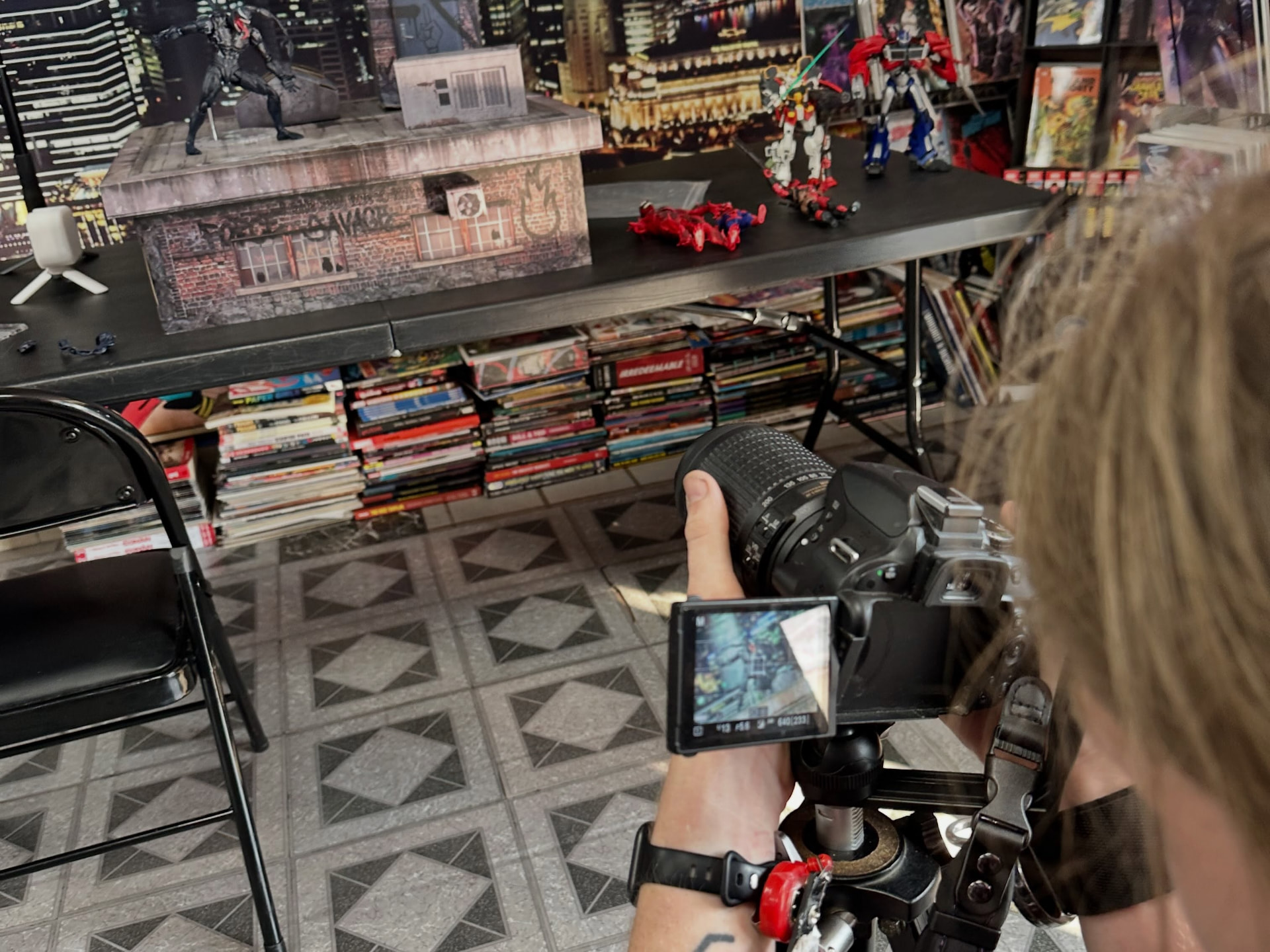 Setting up a rooftop diorama shot with a camera on a tripod